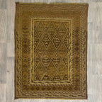 Handmade Afghan brown Mushwani tribal rug featuring a unique combination of flat-weave kilim and raised wool pile geometric diamond patterns, displayed on a light oak wood floor.