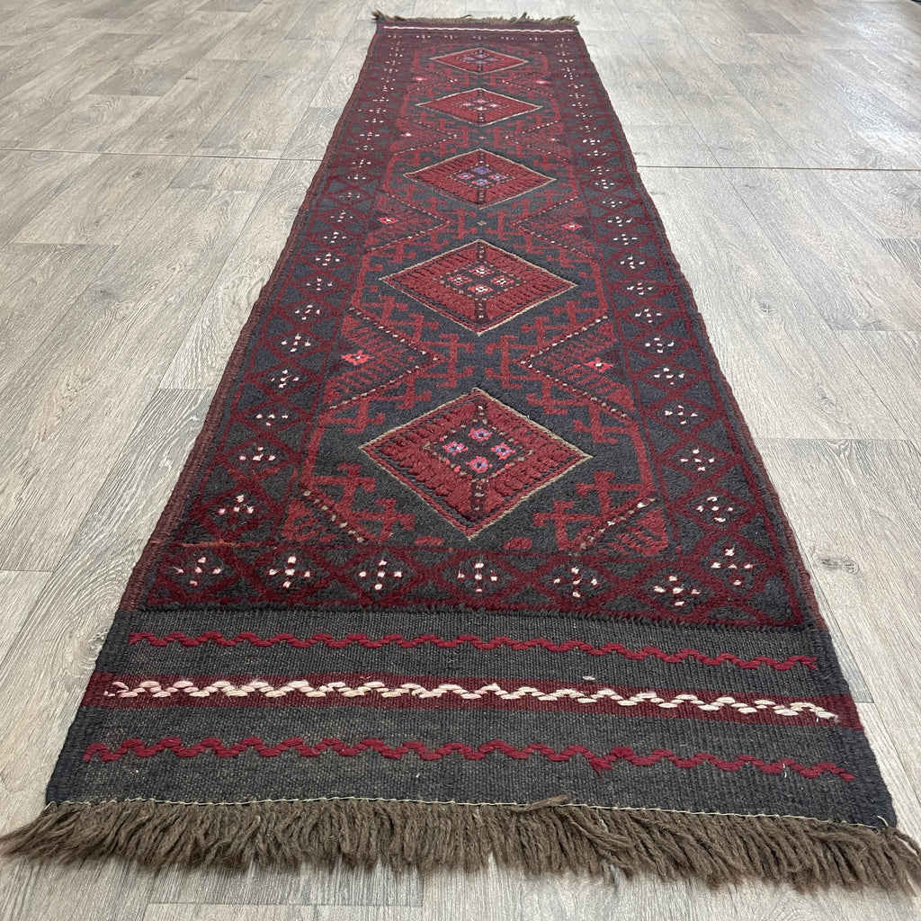 mushwani runner with geometric pattern on a wooden floor
